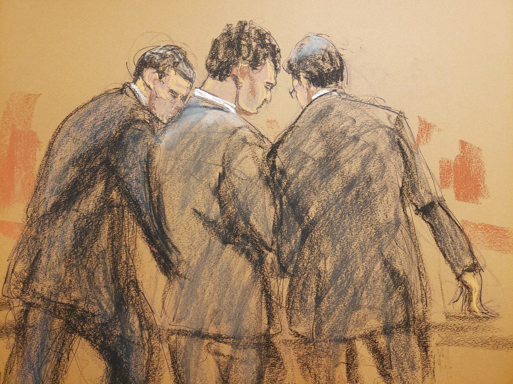 Bankman-Fried posa com seu advogado após a leitura do veredicto em 2 de novembro.